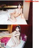 A naked woman sitting on a bed in a hotel room.