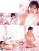 A woman laying on top of a bed holding a pillow.